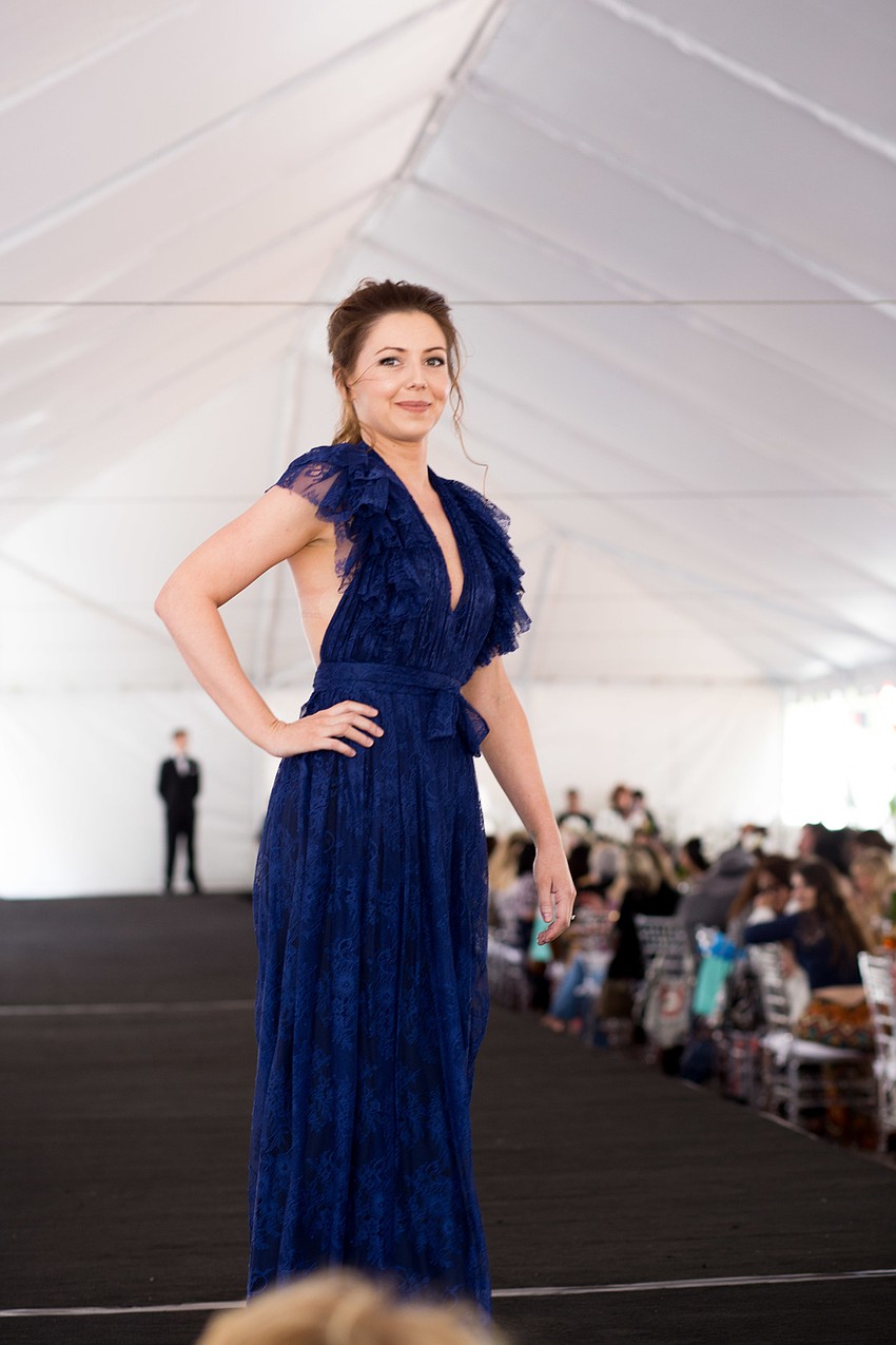 Models stopped at the end of the runway to show off each side of the dress to the crowd.