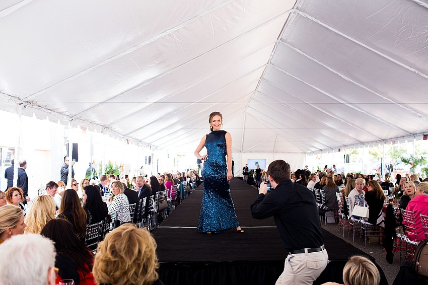 Model Lauren Henry struts down the aisle.