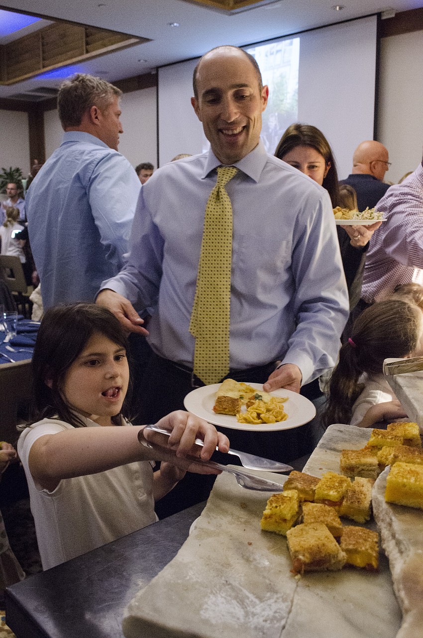 Joe Feldman gets served by his daughter, Brooke.