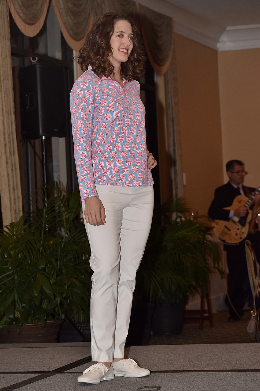 Former Longboat Key Garden Club scholarship recipient Jamie Schindewolfe models clothes from Island Pursuit.