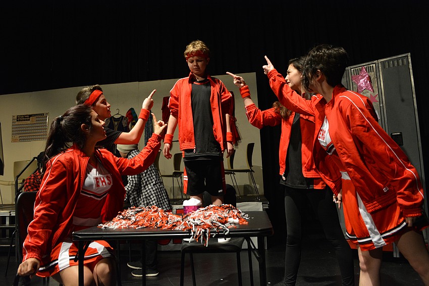 Despite objections from his friends, Ian Strang, center, is determined to profess his love to the school's star actress by baking her dessert.