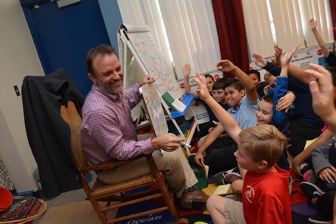 Braden River Elementary School fourth-grade teacher Nicholas Leduc tests his students on the types of triangles.