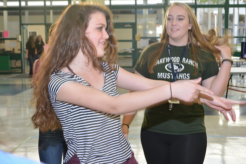 Sofia Gonzalez gets moving in front of Angela Baldino.