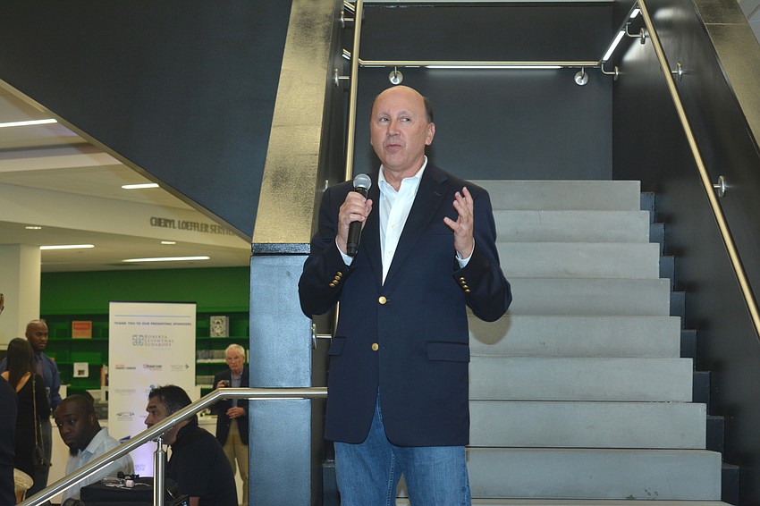 Mark Pritchett, president and CEO of the Gulf Coast Community Foundation, addresses the crowd at Goldstein Library.