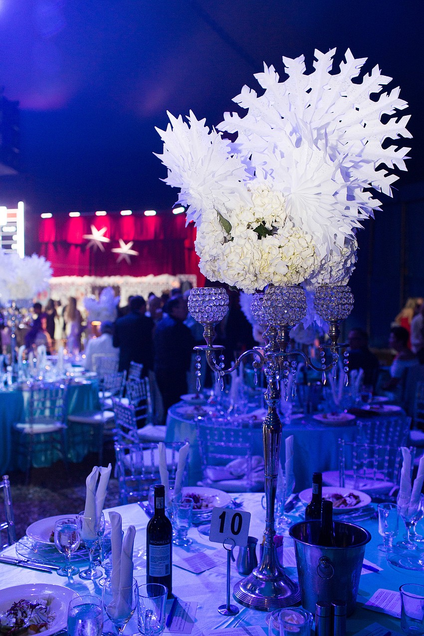 The white decor glistened under the blue lights.