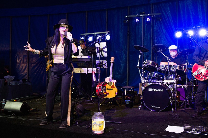 Sheri Nadelman of soul R coaster performs on stage.