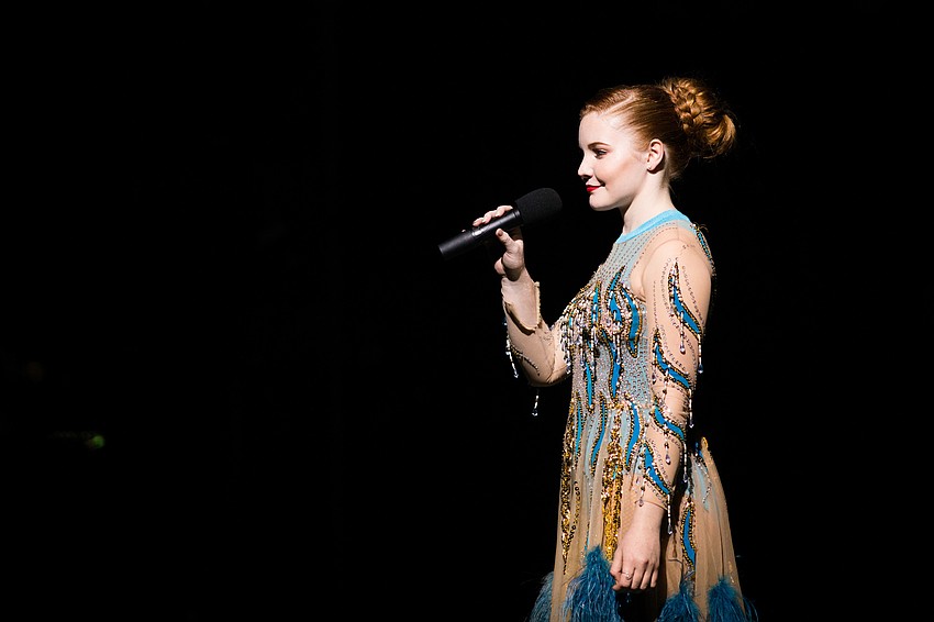 Grace Johnson, ringmistress, addresses the crowd.