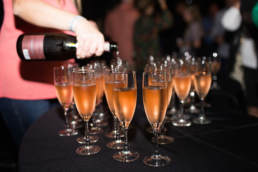 Champagne is poured for the VIPs in the shopping room.