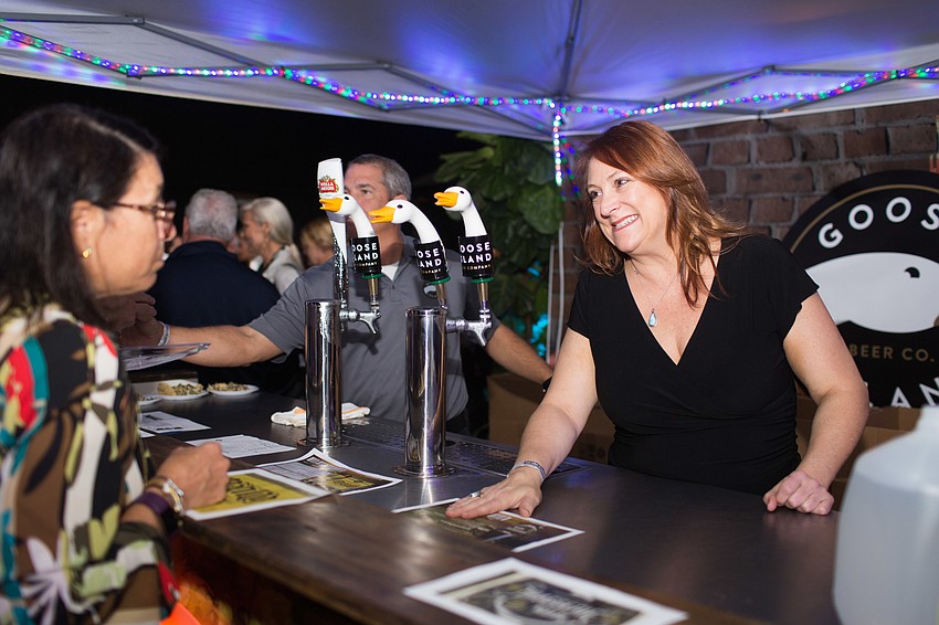 Tiffany Cureau serves beer from Goose Island.