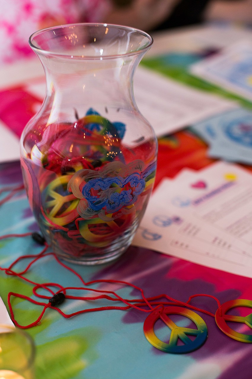 Peace sign necklaces were given to each guest that walked in.