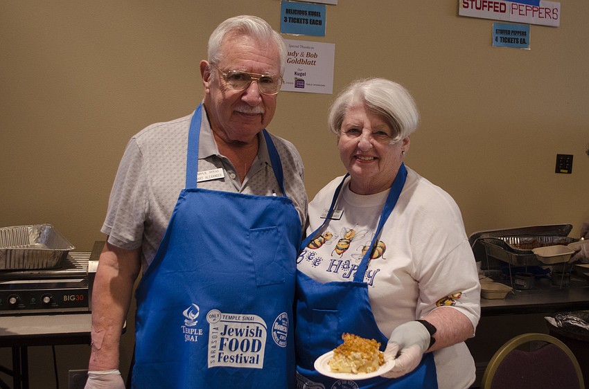 Stuart and Cecile Alexander serve kugel.