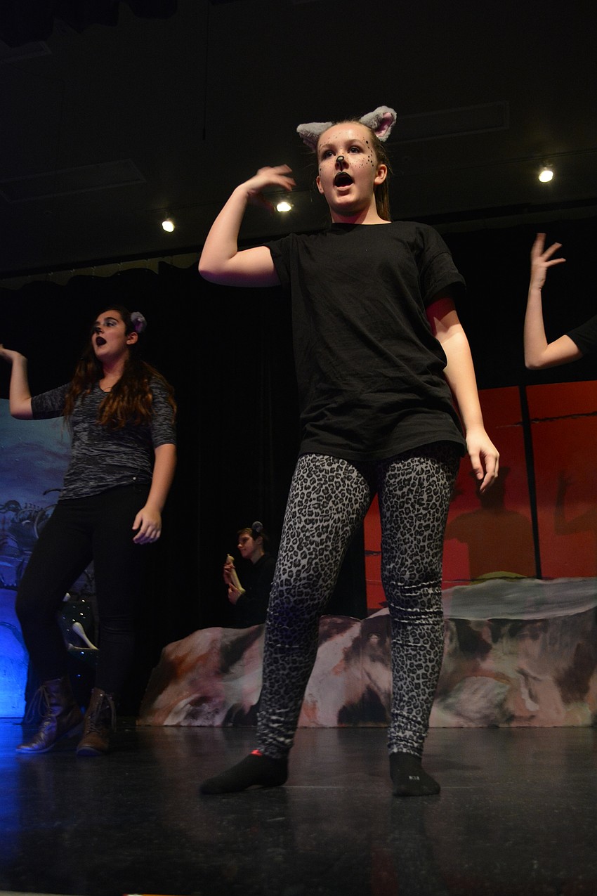 Madison Flower, a hyena, dances to celebrate Scar taking over as king.