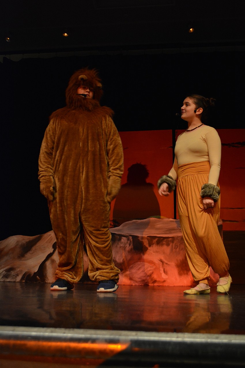 Mufasa, played by Jacob Cole, shares with the young Simba, played by Sienna Zwizinski, how it is OK to be afraid.