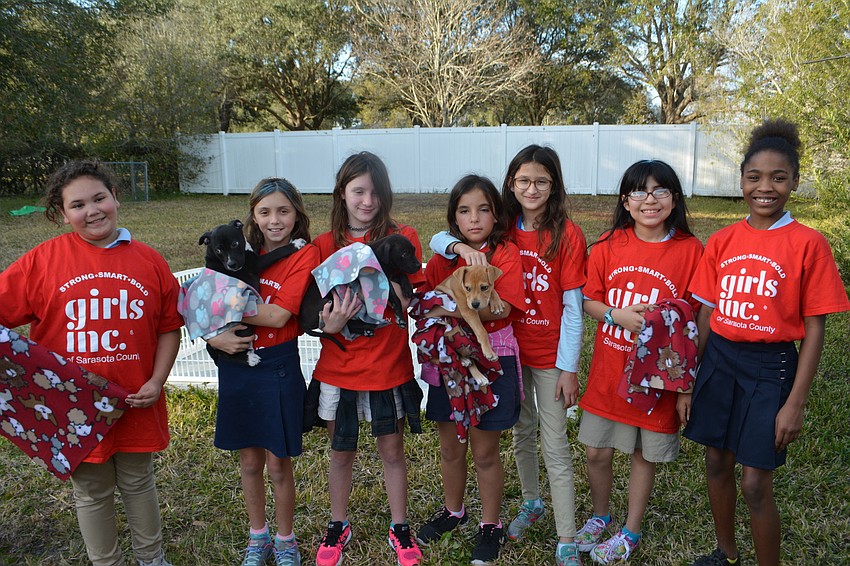 Girls Inc., brought seven of its members to Nate's Honor Animal Rescue to present 113 blankets made by the group.