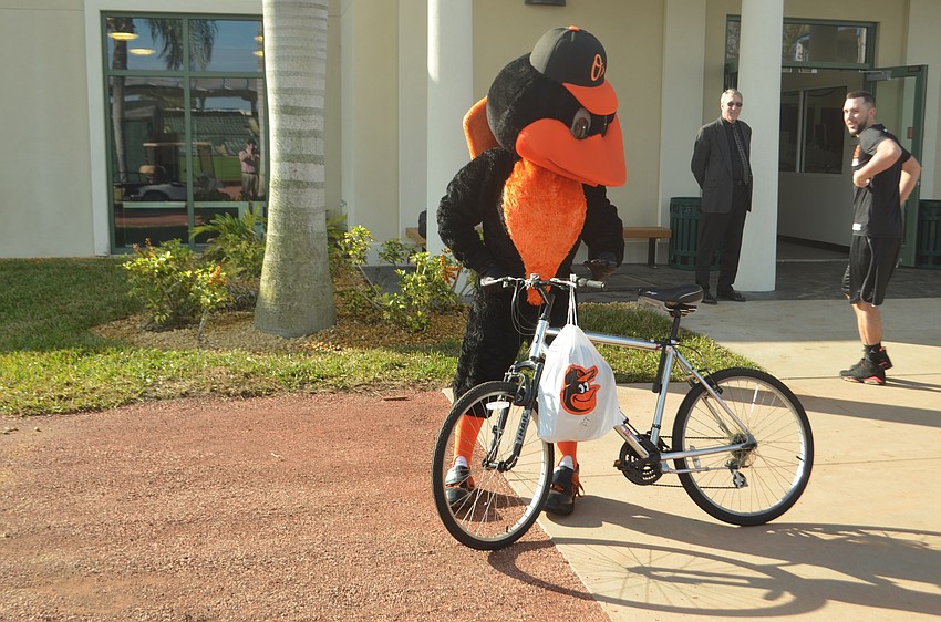 The Bird takes out a bike from the moving van.