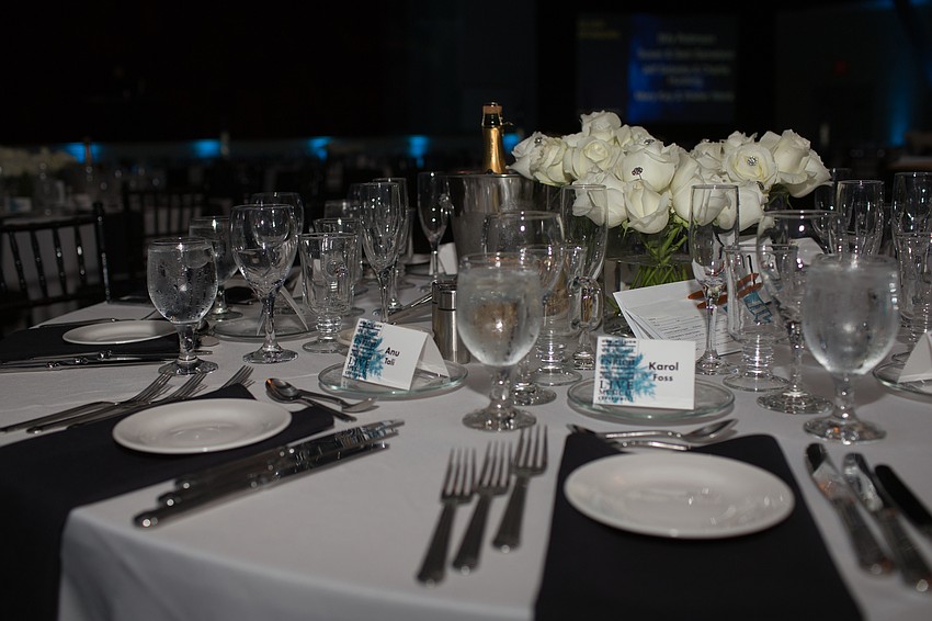 Napkins placed were placed on each place-setting to transform the tables into a piano keyboard.