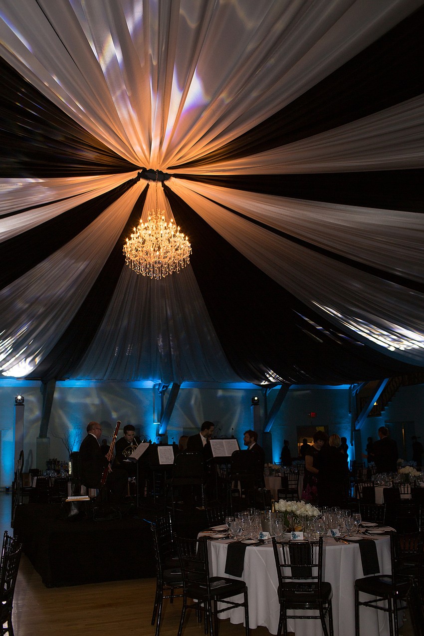 The room was lit up with blue lights and the ceiling was striped black and white.