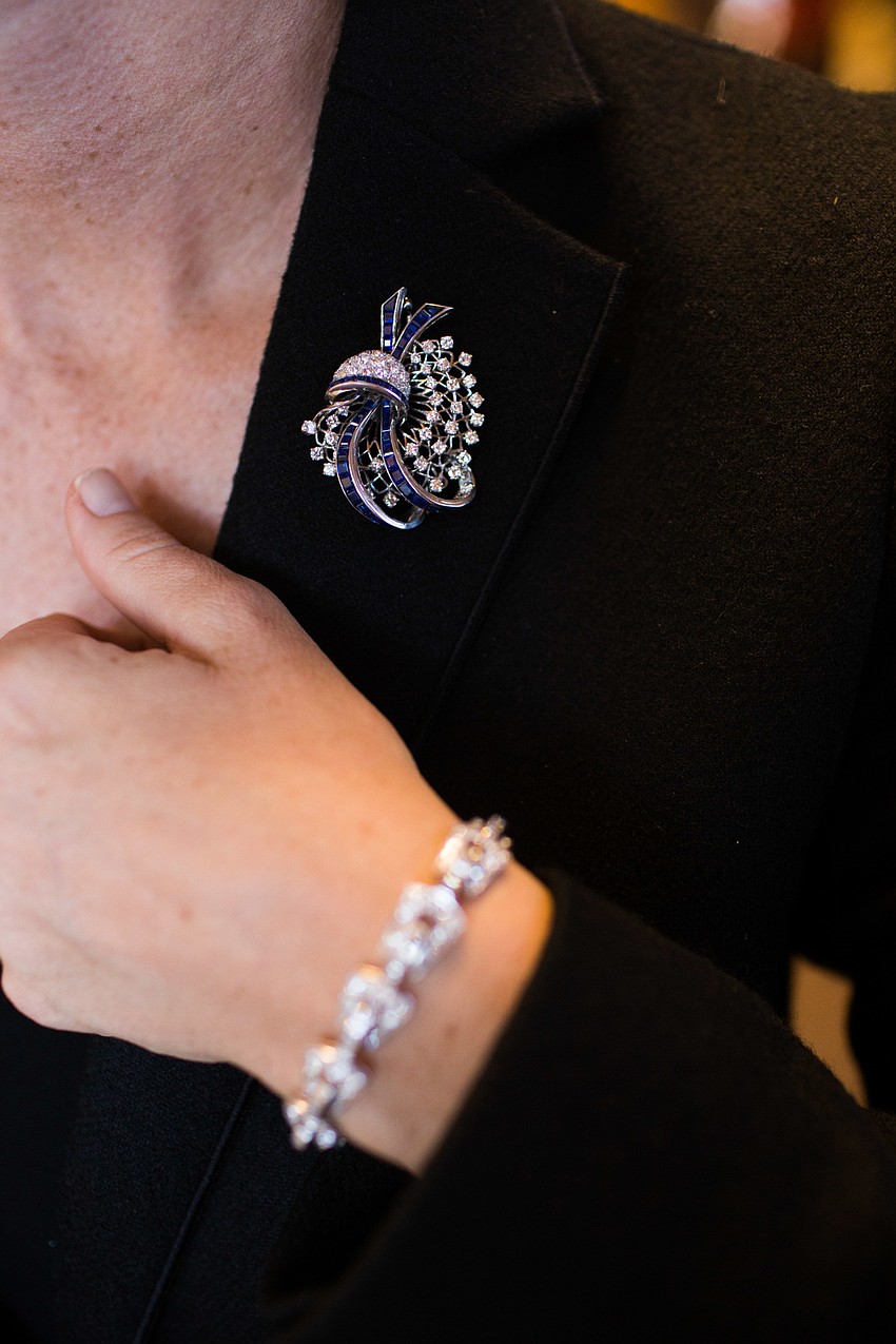 Kristin Vaughn models an Oscar Heyman brooch, valued between $3,000 and $5,000, and an art deco bracelet.