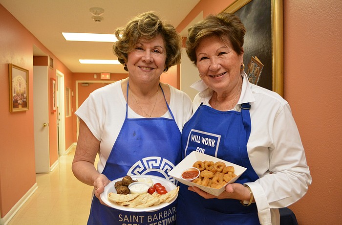 Lakewood Ranch's Paree Gardner and Greenfield Plantation's Linda Pape show off appetizer plates they will be selling at the Greek Festival.