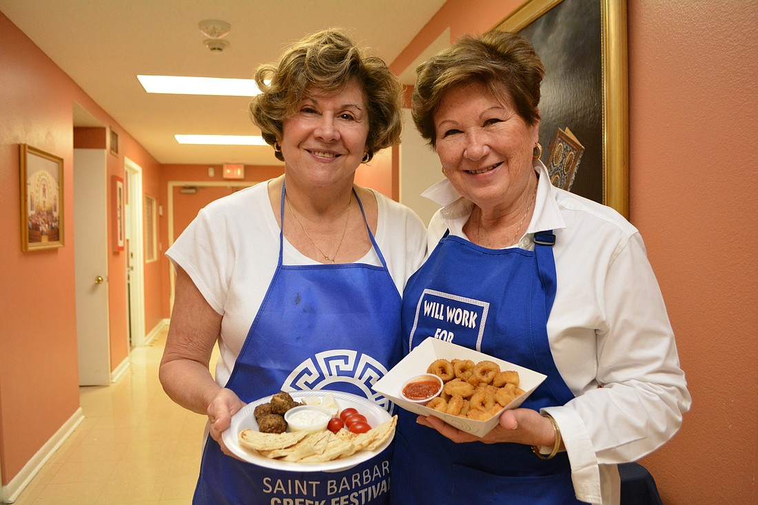 Lakewood Ranch&#39;s Paree Gardner and Greenfield Plantation&#39;s Linda Pape show off appetizer plates they will be selling at the Greek Festival.