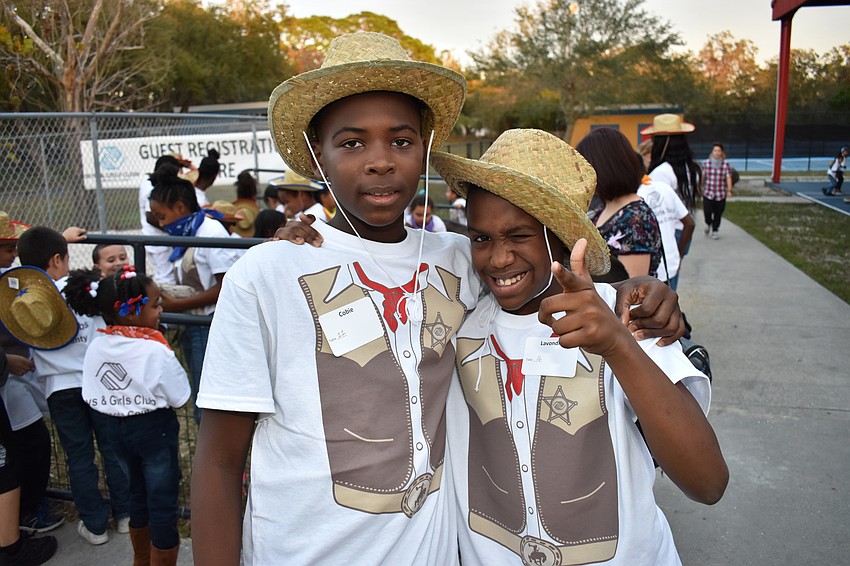 Club members Cobie and Lavondre hang out in the petting zoo.