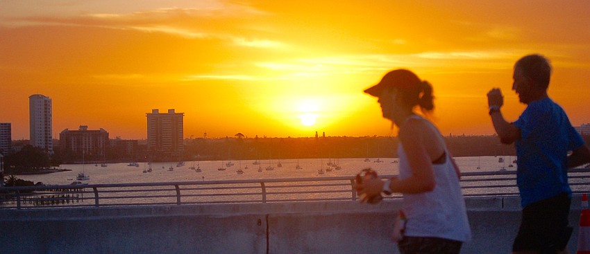 About 40 minutes after the race began, the sun rose over Sarasota Bay.