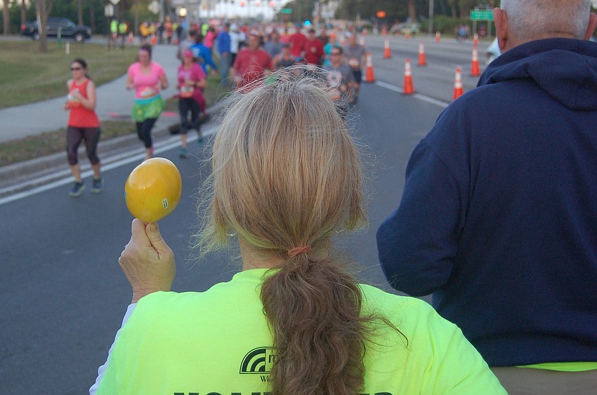 Volunteer Maria Gwillem made some noise to encourage the runners.