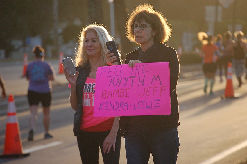 Sherri Vroom and Audrey Bear stood by along the route to not only photograph their friends, but also to urge them on.