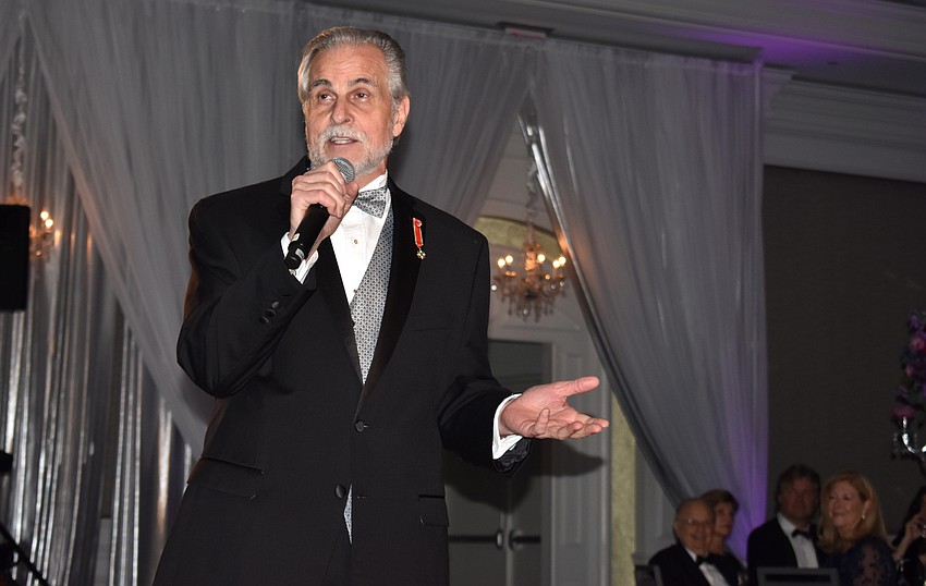 Maestro Victor DeRenzi welcomes guests.