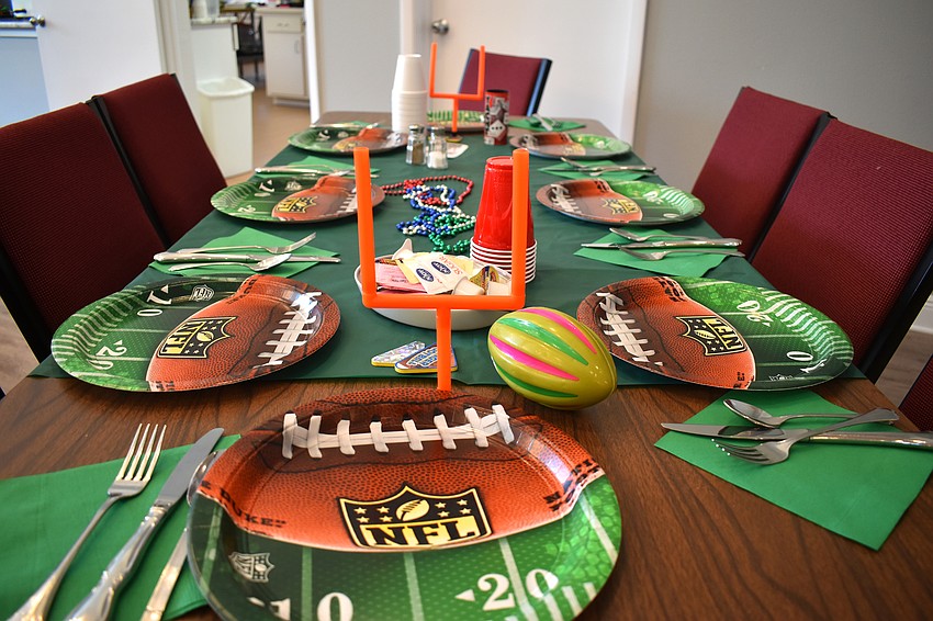 Each table was set with football themed decorations, including mini goal posts.