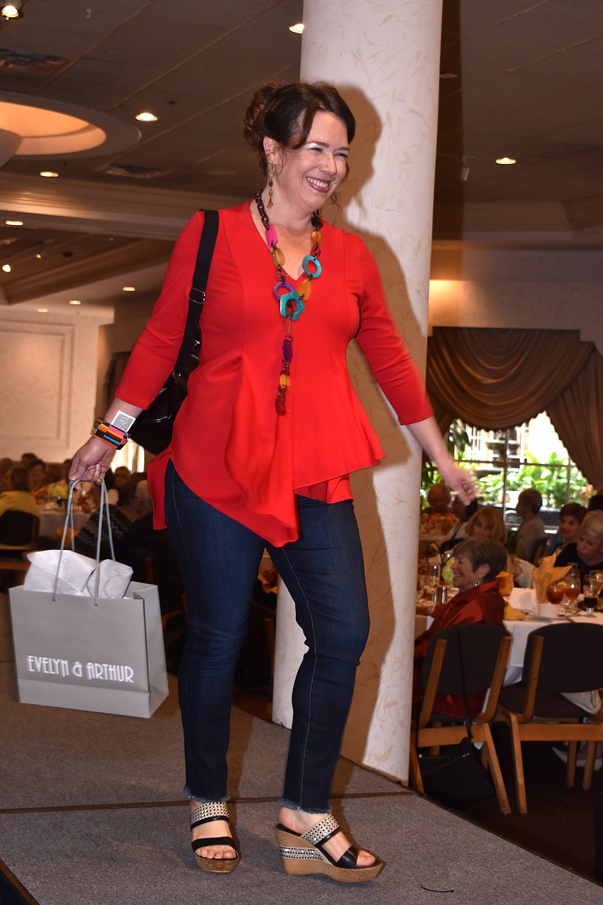Lisa Mirman is all smiles as she walks the runway.