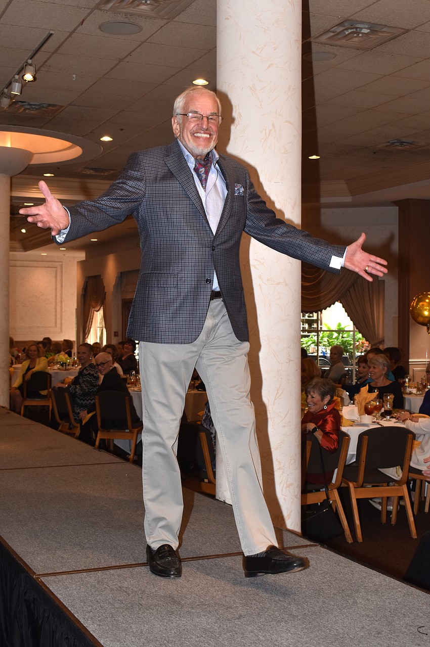 Walter Frank strikes a pose for the crowd as he walks the runway.