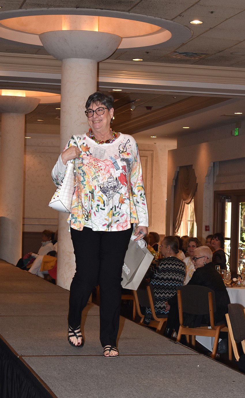 Debbie Cohen walks the runway during the Temple Beth Israel fashion show.