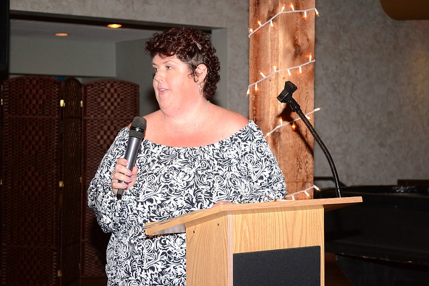 Kerry Evans gives a speech at the event.