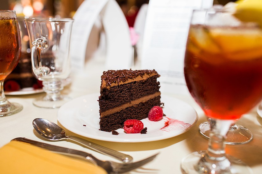 The dessert placed at each table was a chocolate cake with raspberries.