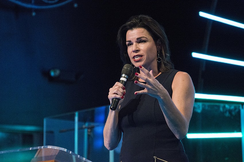 Selah Freedom co-founder Elizabeth Melendez-Fisher congratulates the survivors.