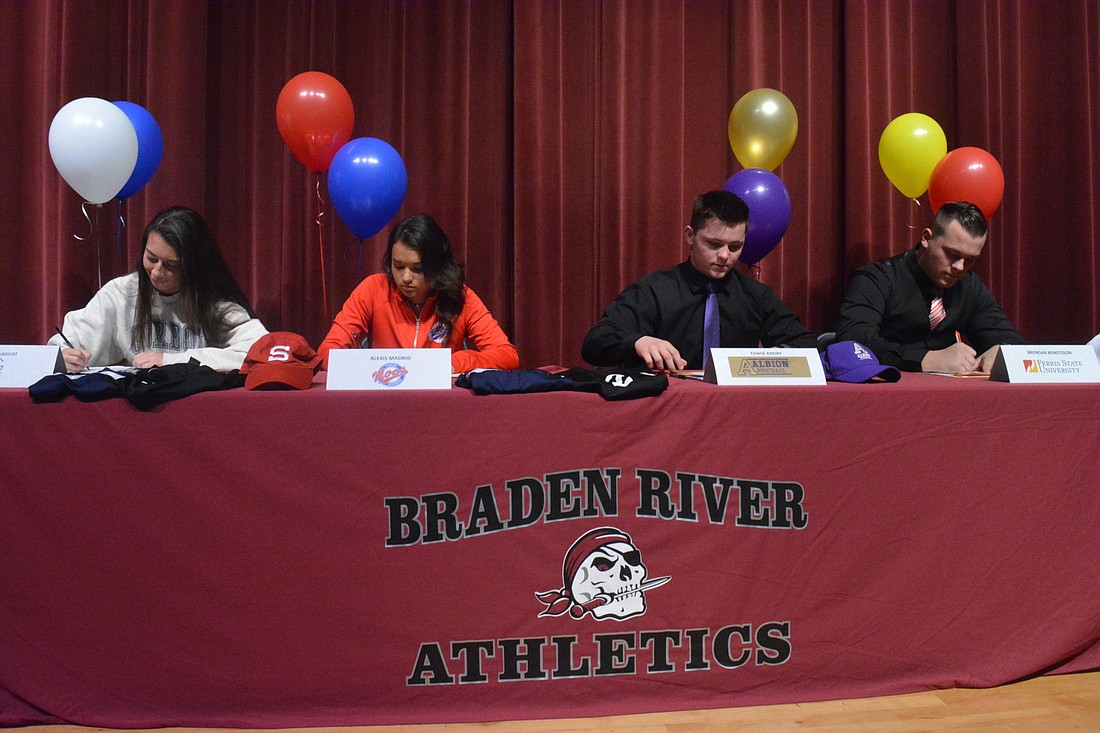 Braden River High seniors Isabelle Vazquez, Alexis Madrid, Chase Knopf and Brendan Bengtsson sign their letters of intent.
