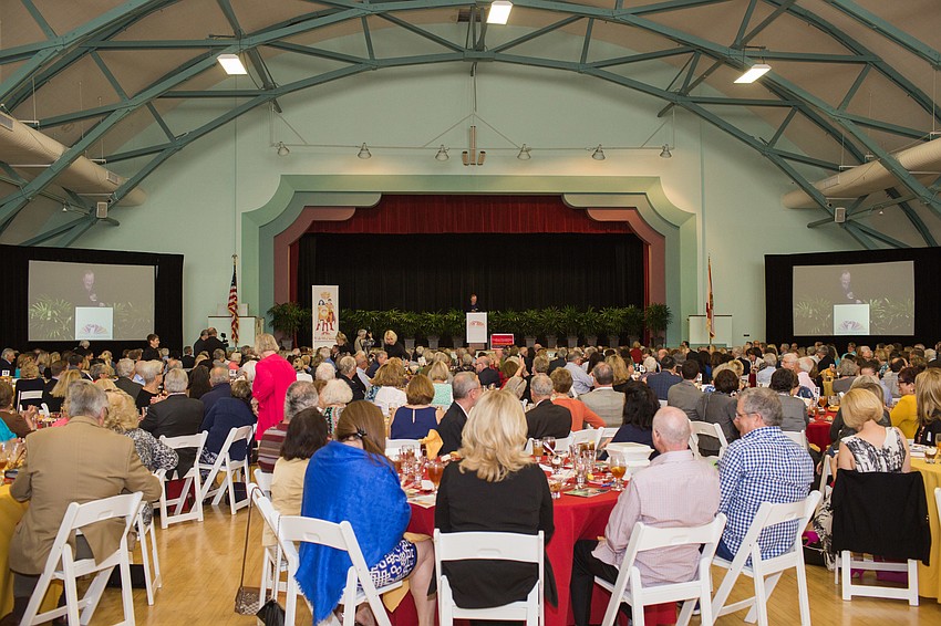 James Patterson presents to 600 Author Luncheon attendees in the Sarasota Municipal Auditorium.
