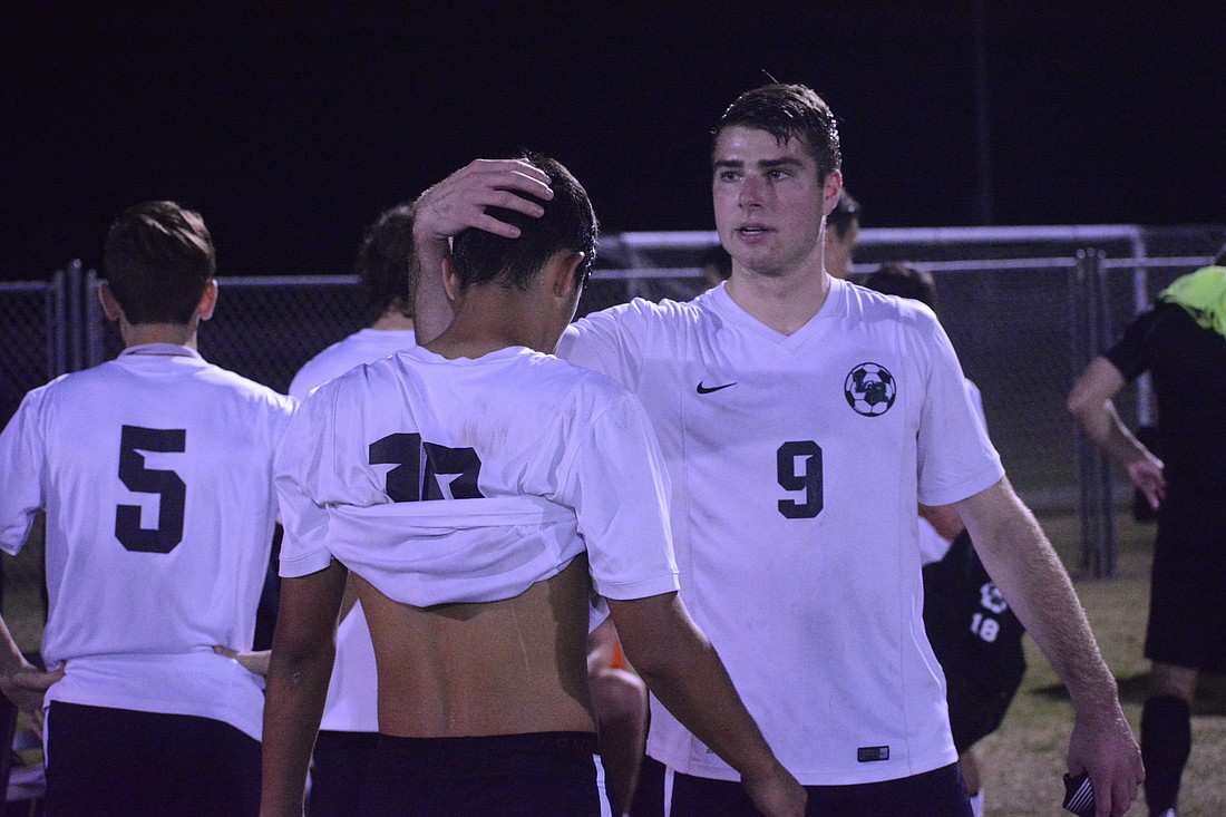 Junior Wilmer Yanez (10) gets a tap on the head from junior Travis Freeman (9) following the Mustangs&#39; 2-1 loss to Wiregrass Ranch High. Freeman scored the Mustangs&#39; only goal.