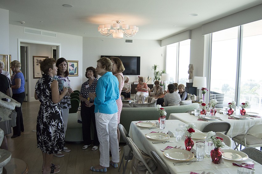 The group gathered in President Ginny Akhoury's home.