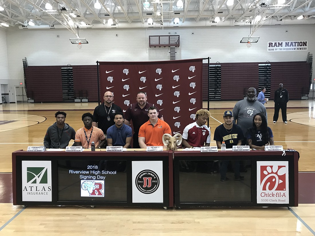 Riverview High seniors Arthur Brantley, Tavares Campbell, Cleve Grantley, Moose Griffith, Jamar Johnson, Brantley Seadrow and Aliyah Cunningham sign their letters of intent.