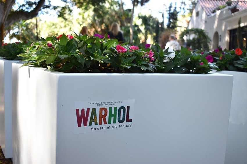 Impatiens in red, purple, pink, orange and white fill white cubes that appear throughout the grounds, continuing the stylized themes of repetition, grids and color. Photo by Niki Kottmann