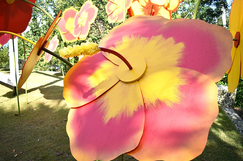 Oversize, fabricated hibiscus flowers provide a colorful, waterfront scene that celebrates nature as art. Photo by Niki Kottmann