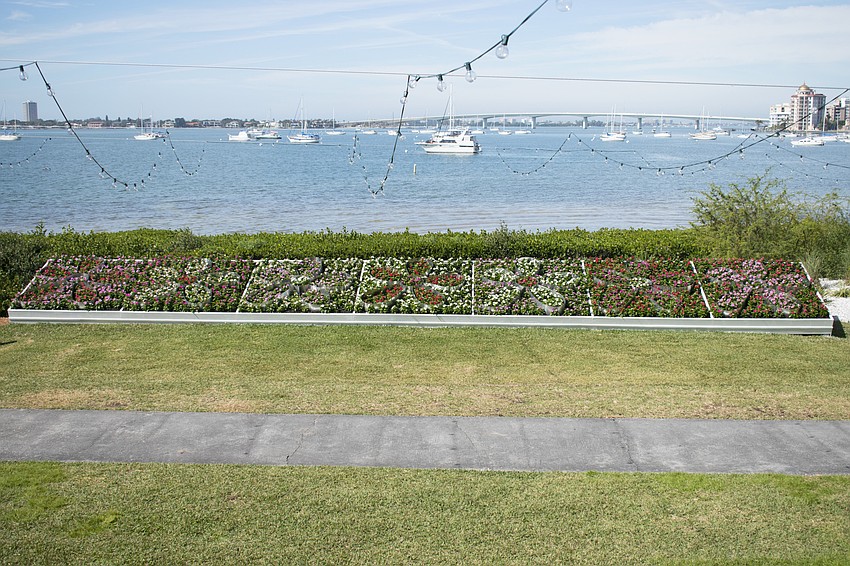 A display of a variety of Madagascar periwinkle are planted in the shape of daisy flowers – an image often featured in Warhol’s work – overlook Sarasota Bay. Photo by Niki Kottmann