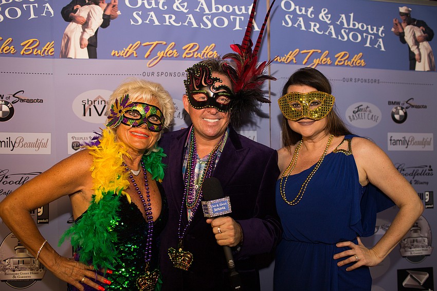 The Out & About Sarasota team, Chacha, Tyler and Heather, dressed up for the mardi gras occasion.