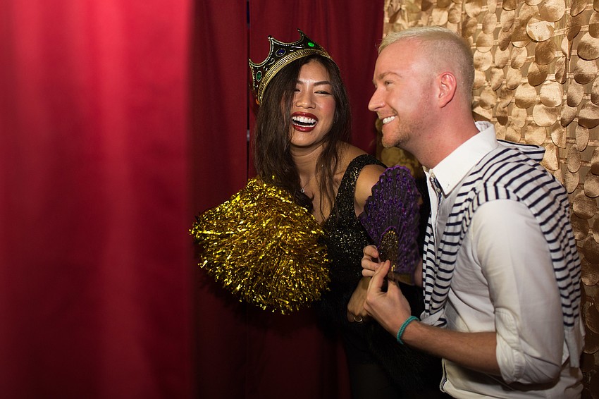 Patra Jordan and Joshua Beadle post for photos in the photo booth.
