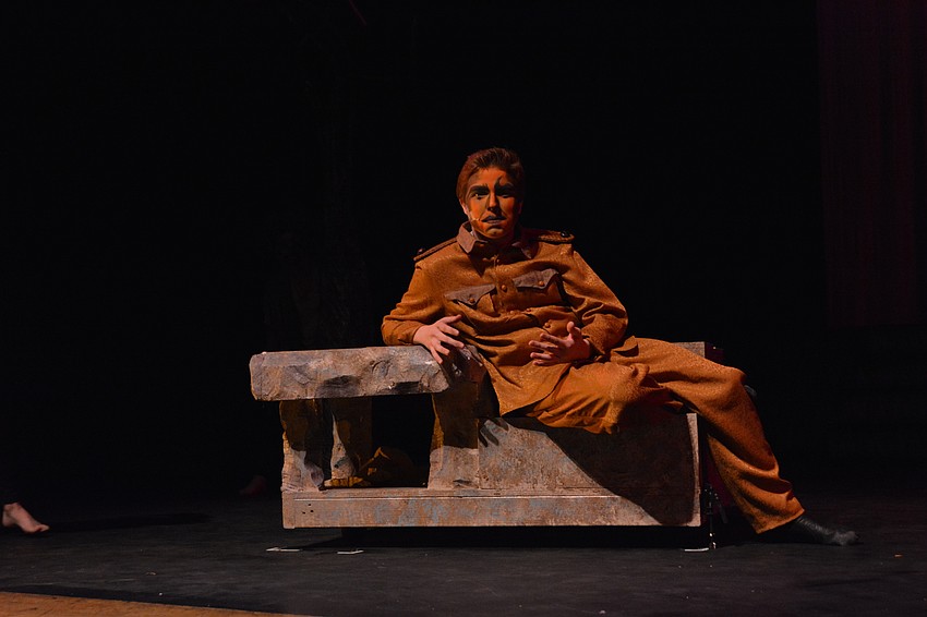 Scar, played by John Todd Girman, basks amongst the hyenas before unleashing his dream of having hyenas and lions live together.