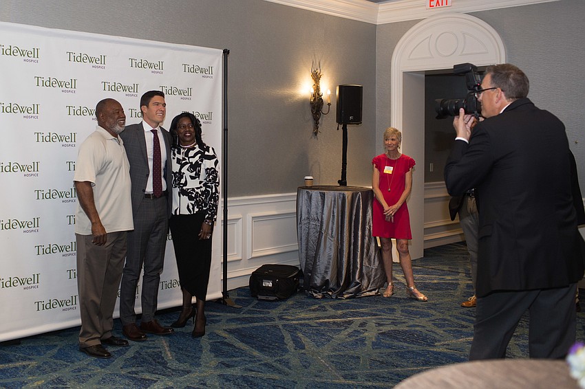 Shirley Zeigler and Whizz Howard get their photo taken with Will Reeve.