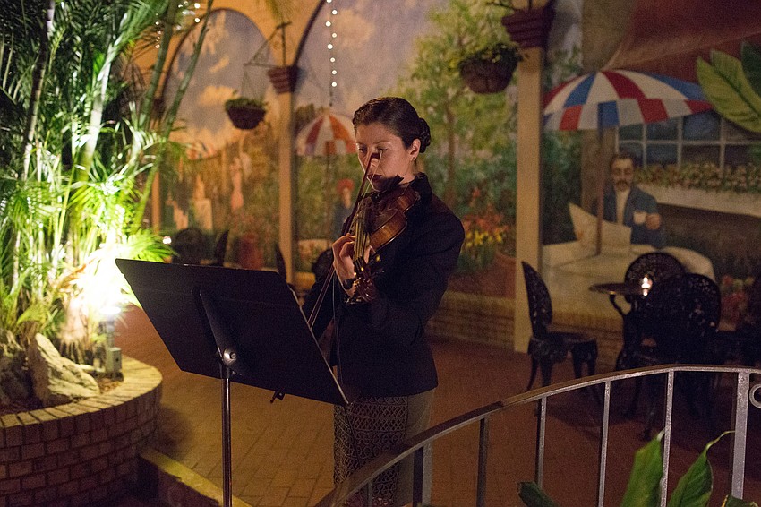 Adriana Rodriguez played the violin for the cocktail hour in the Michael's On East courtyard.