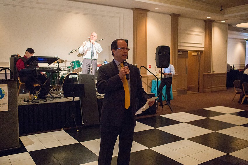 Hector Munoz, master of ceremonies, gives the opening welcome.